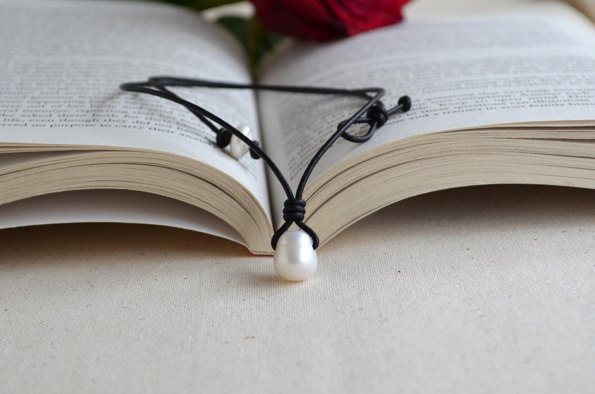 Pearl necklace on an open book