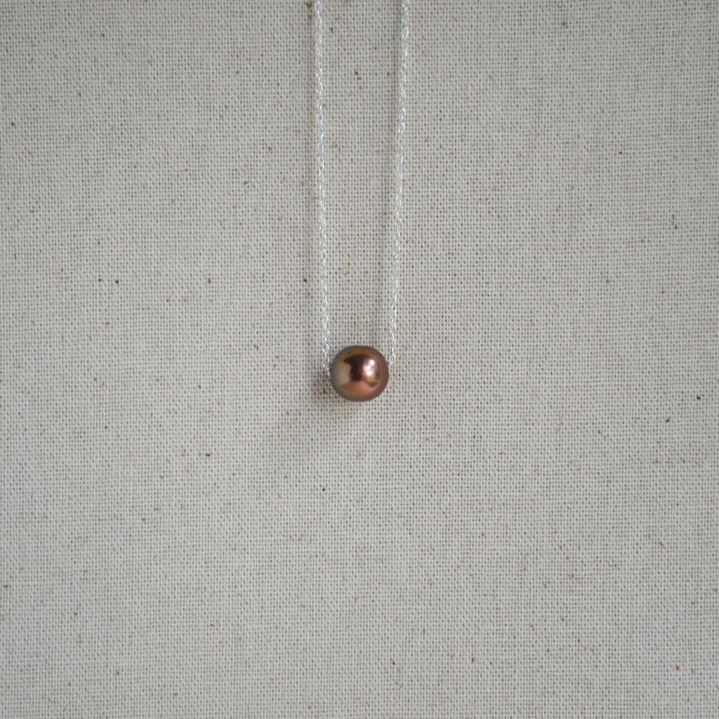 Chocolate Edison pearl floating necklace close-up, warm bronze luster, sterling silver chain