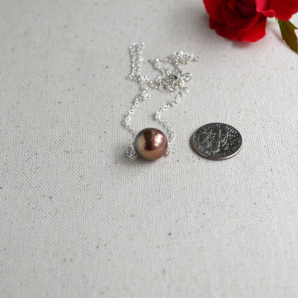 Single Edison pearl necklace detail shot, natural chocolate-bronze color with golden overtones