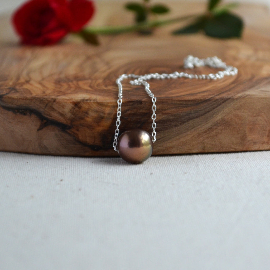 Chocolate Edison pearl necklace flat lay on white linen with red rose, sterling silver chain, JewelryByYevga