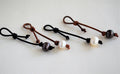 Four pearl leather necklace/bracelet extenders on a white background